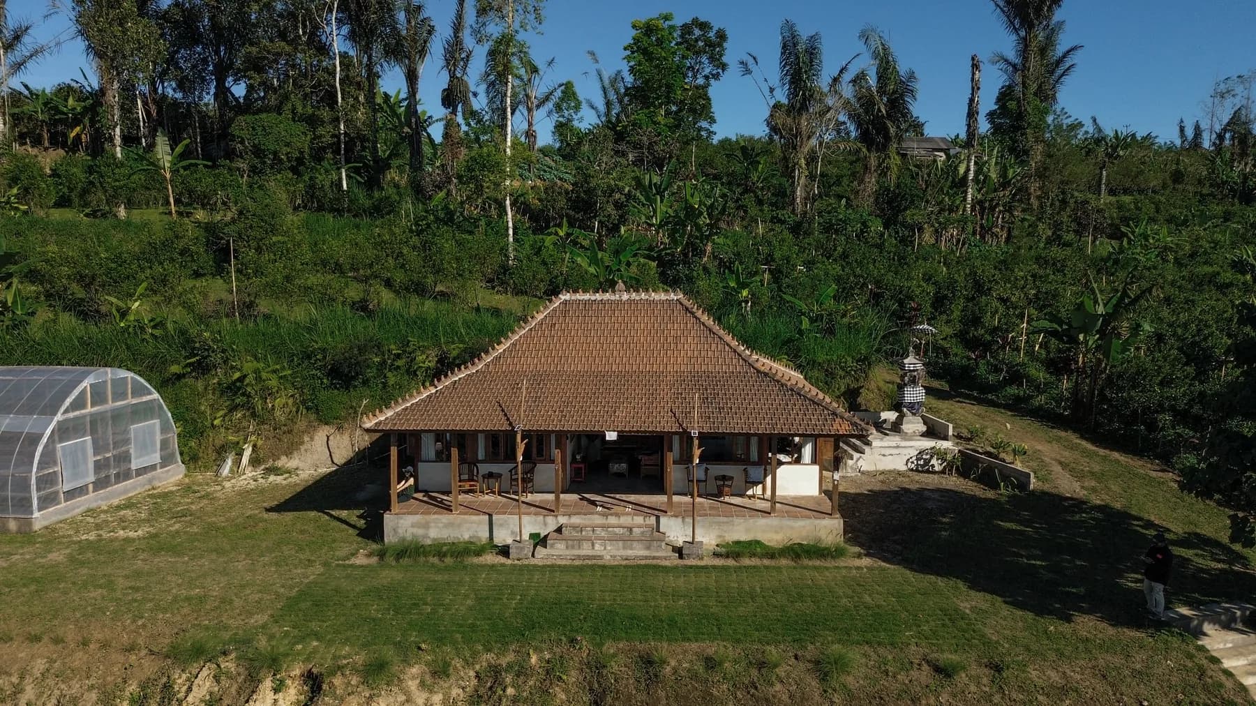The Mengani hillside from the air: the house, the gardens and the highland ridge behind