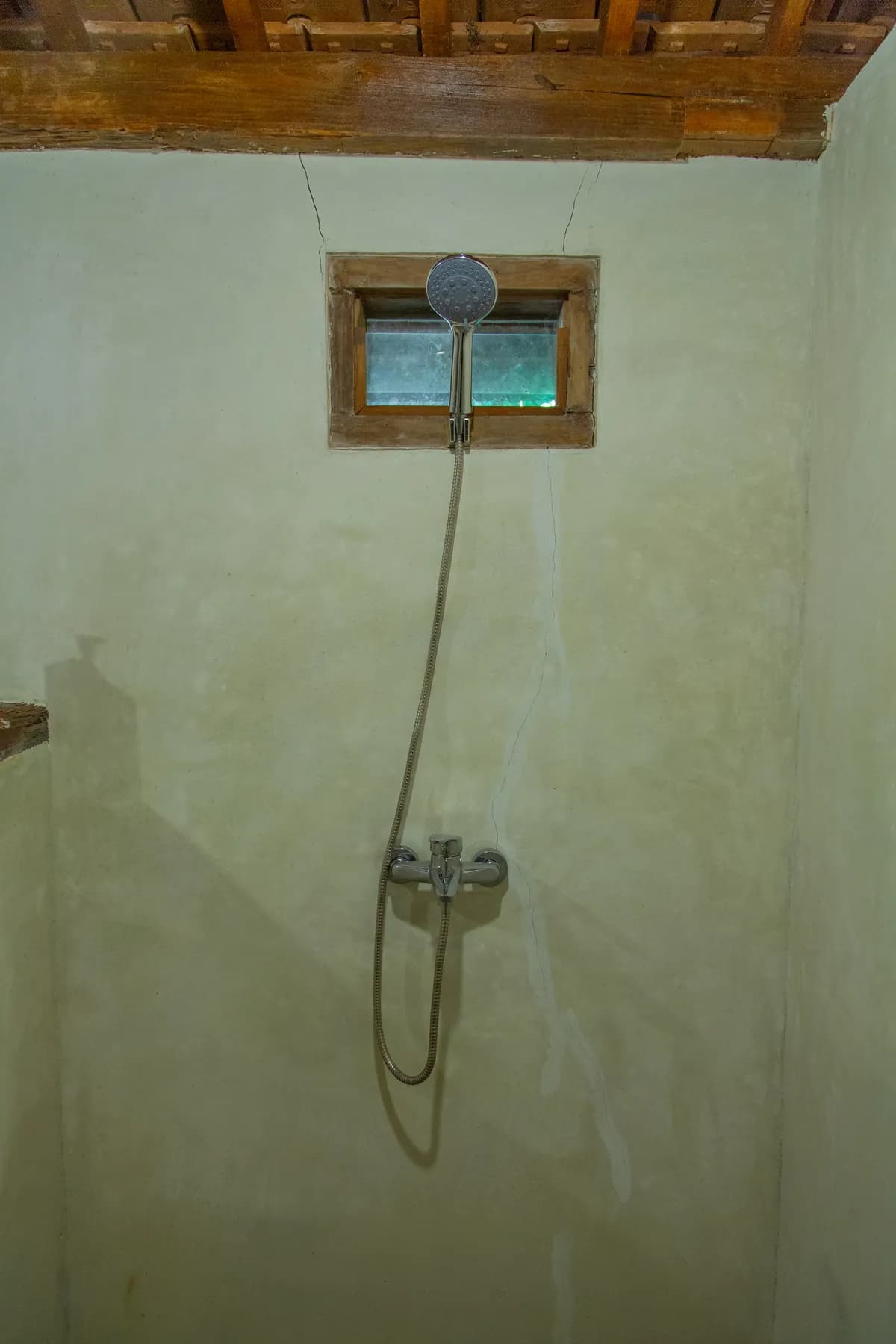 The open shower, lime-washed walls