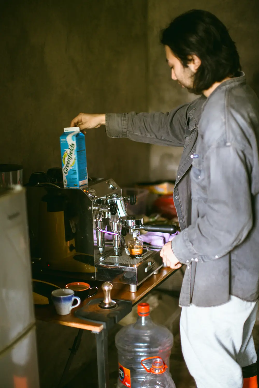 Pouring hot water over freshly ground coffee
