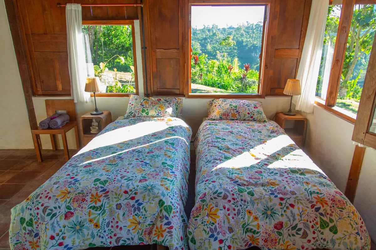 Twin beds under the timber roof