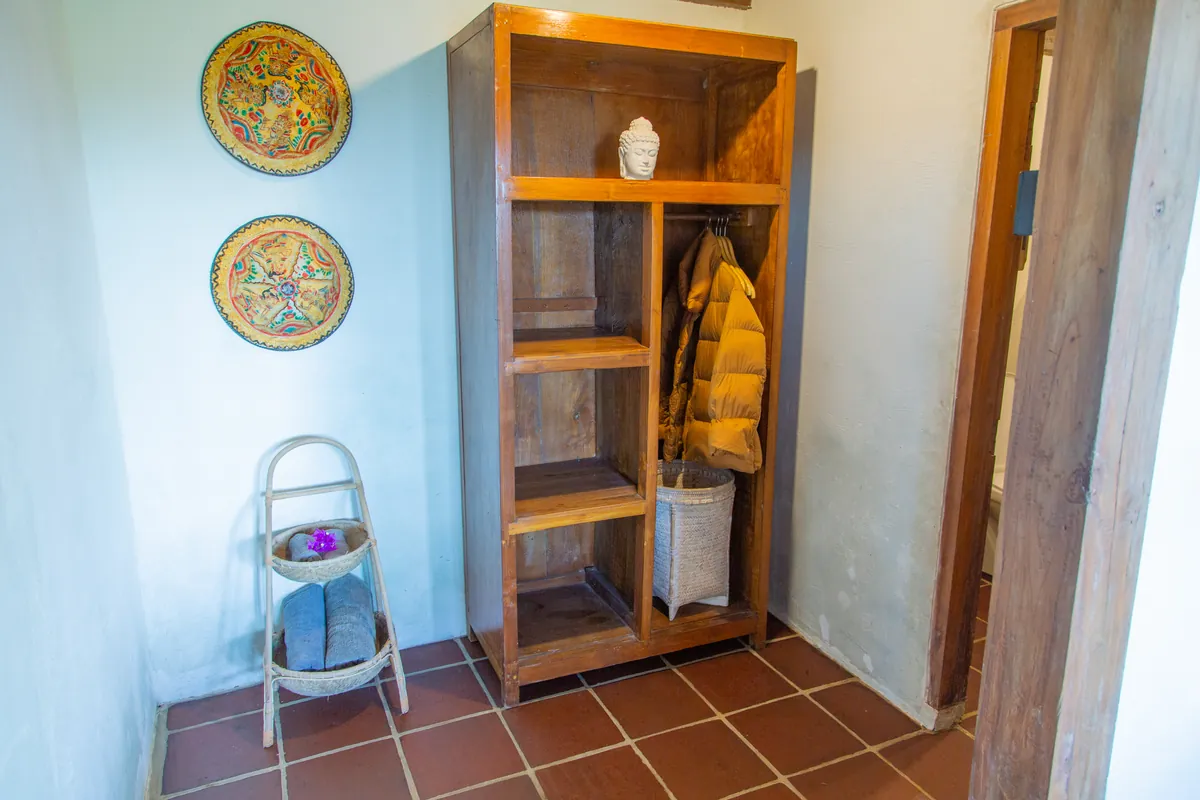 An open wardrobe in a guest room