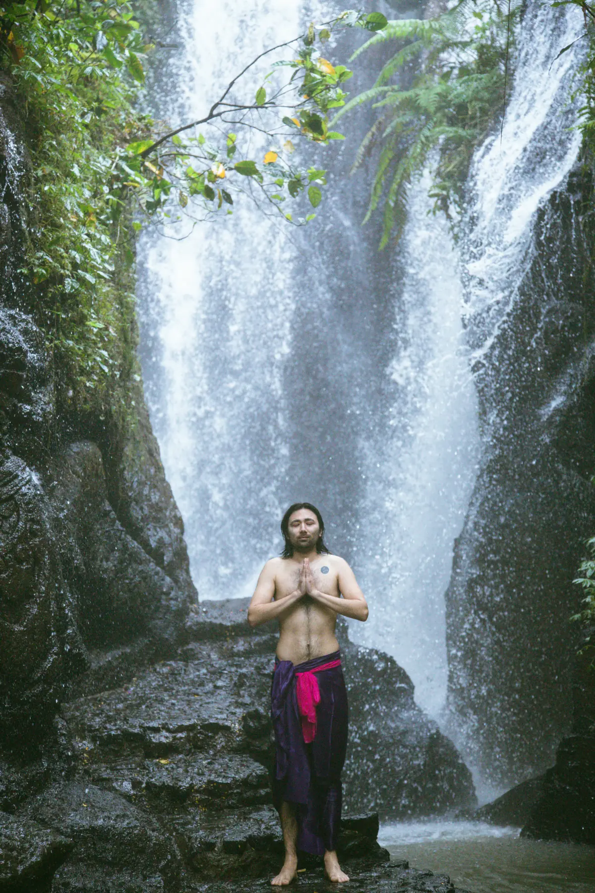 A tall waterfall in the forest, reached on foot from the farm